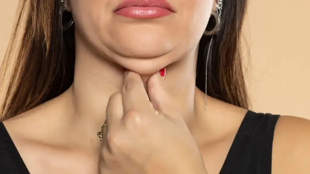 An image of a woman with double chin, sad, worried : Non Surgical Double Chin Removal Treatment in Dunmow, UK